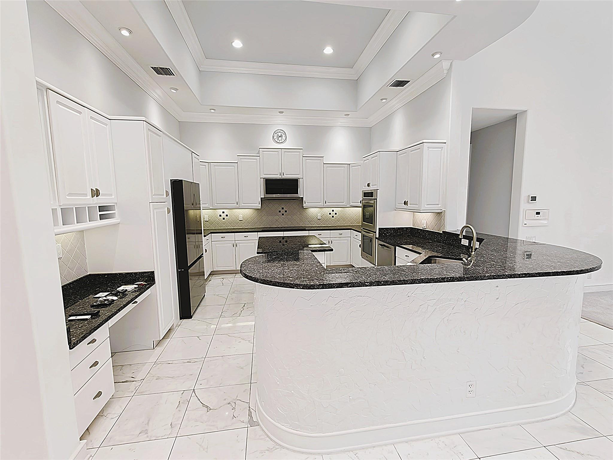 2939 Paddock Lane Weston, FL 33331 - Photo 2 of 86 a kitchen with stainless steel appliances granite countertop a sink a stove a refrigerator and a cabinets