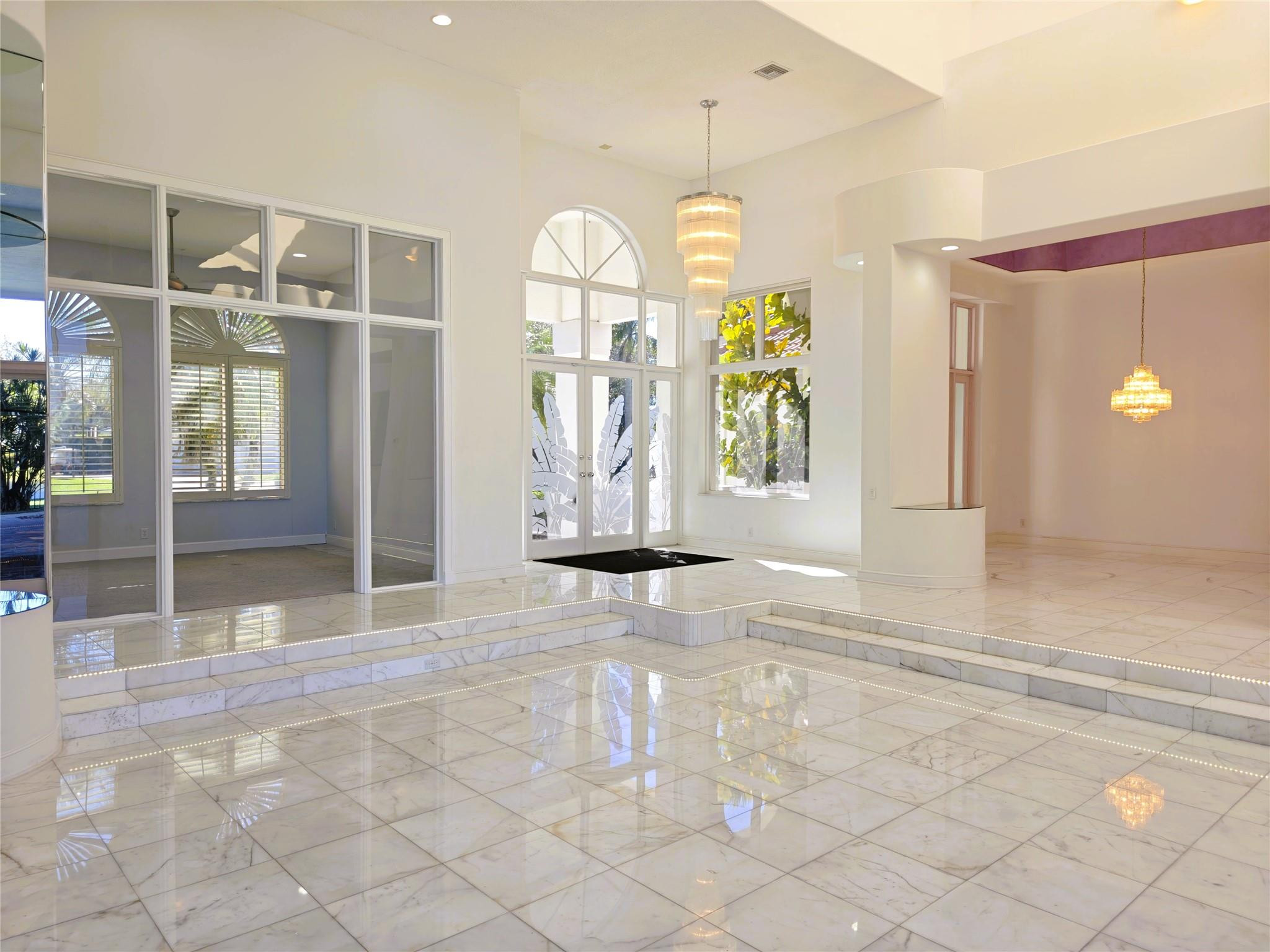 2939 Paddock Lane Weston, FL 33331 - Photo 38 of 86 a view of a hallway with wooden floor and windows