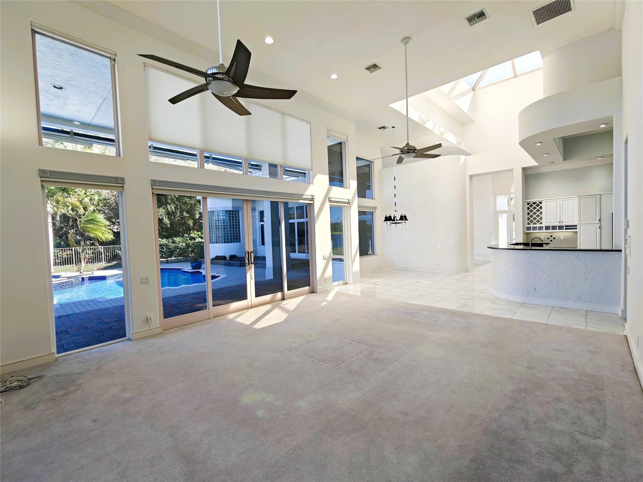 2939 Paddock Lane Weston, FL 33331 - Photo 41 of 86 a view of an empty room with a fireplace and a window