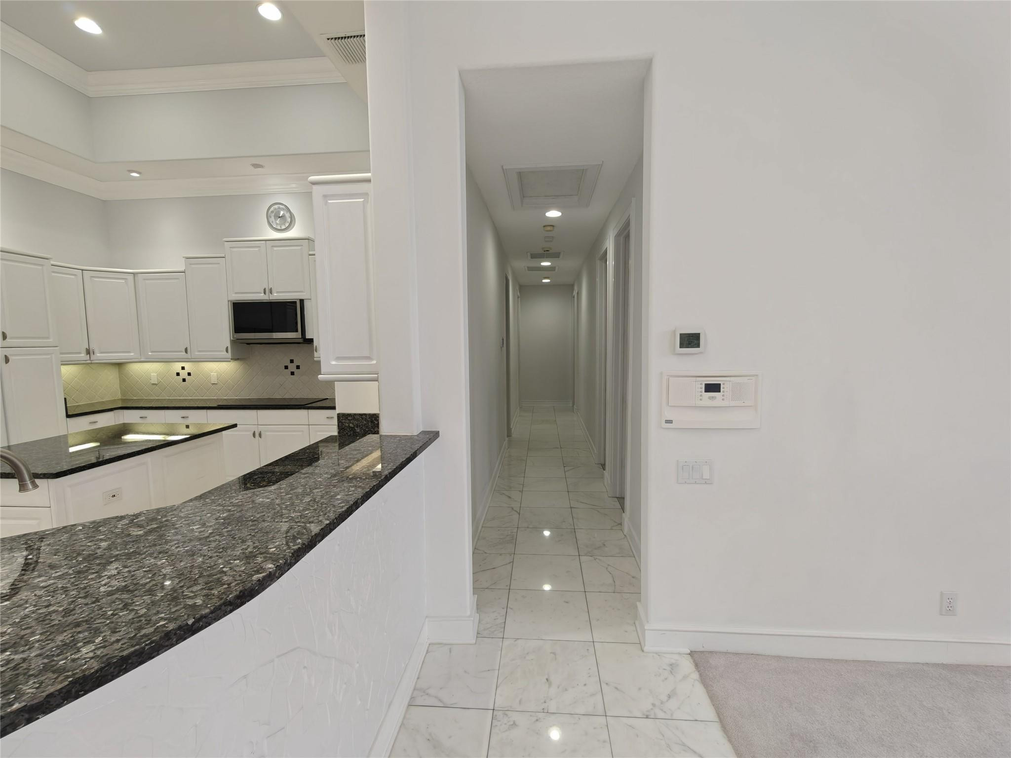 2939 Paddock Lane Weston, FL 33331 - Photo 42 of 86 a large bathroom with a granite countertop sink and a mirror