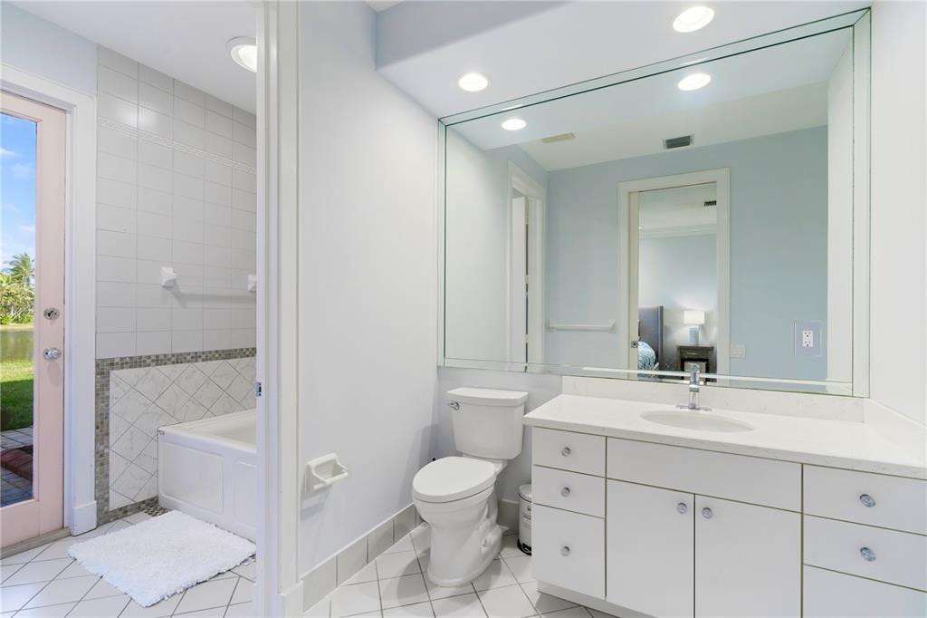 2939 Paddock Lane Weston, FL 33331 - Photo 46 of 86 a bathroom with a toilet sink and mirror