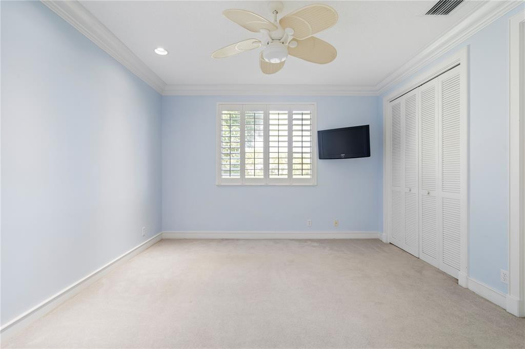 2939 Paddock Lane Weston, FL 33331 - Photo 50 of 86 an empty room with a window and a fan
