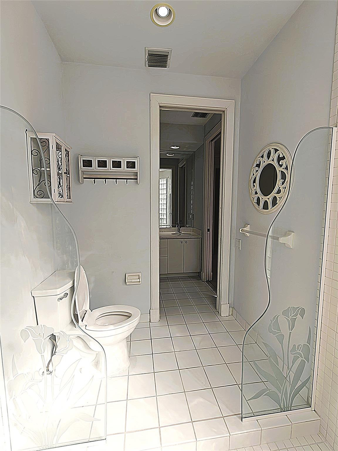 2939 Paddock Lane Weston, FL 33331 - Photo 57 of 86 a bathroom with a sink toilet and shower