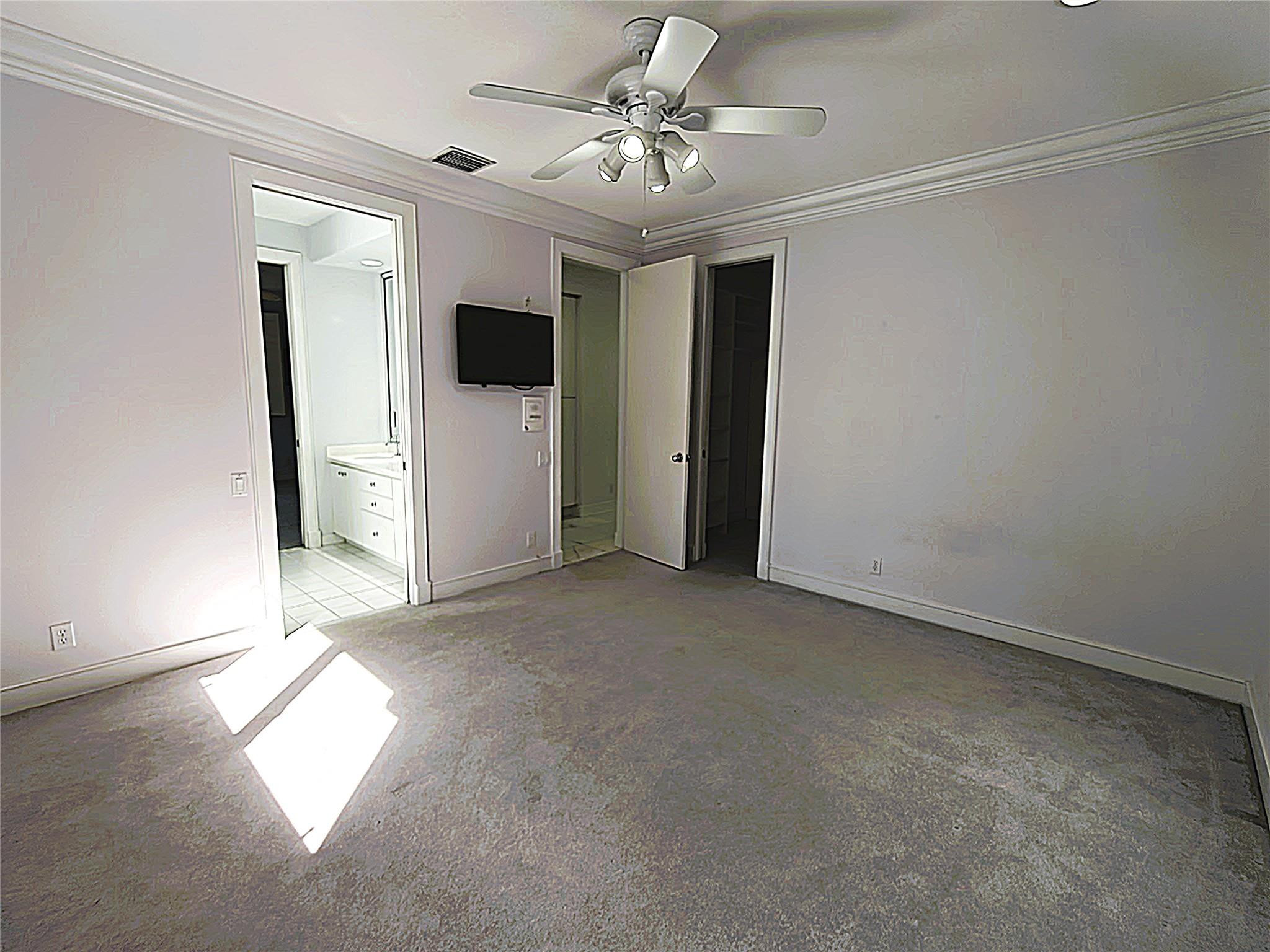 2939 Paddock Lane Weston, FL 33331 - Photo 60 of 86 an empty room with windows and ceiling fan