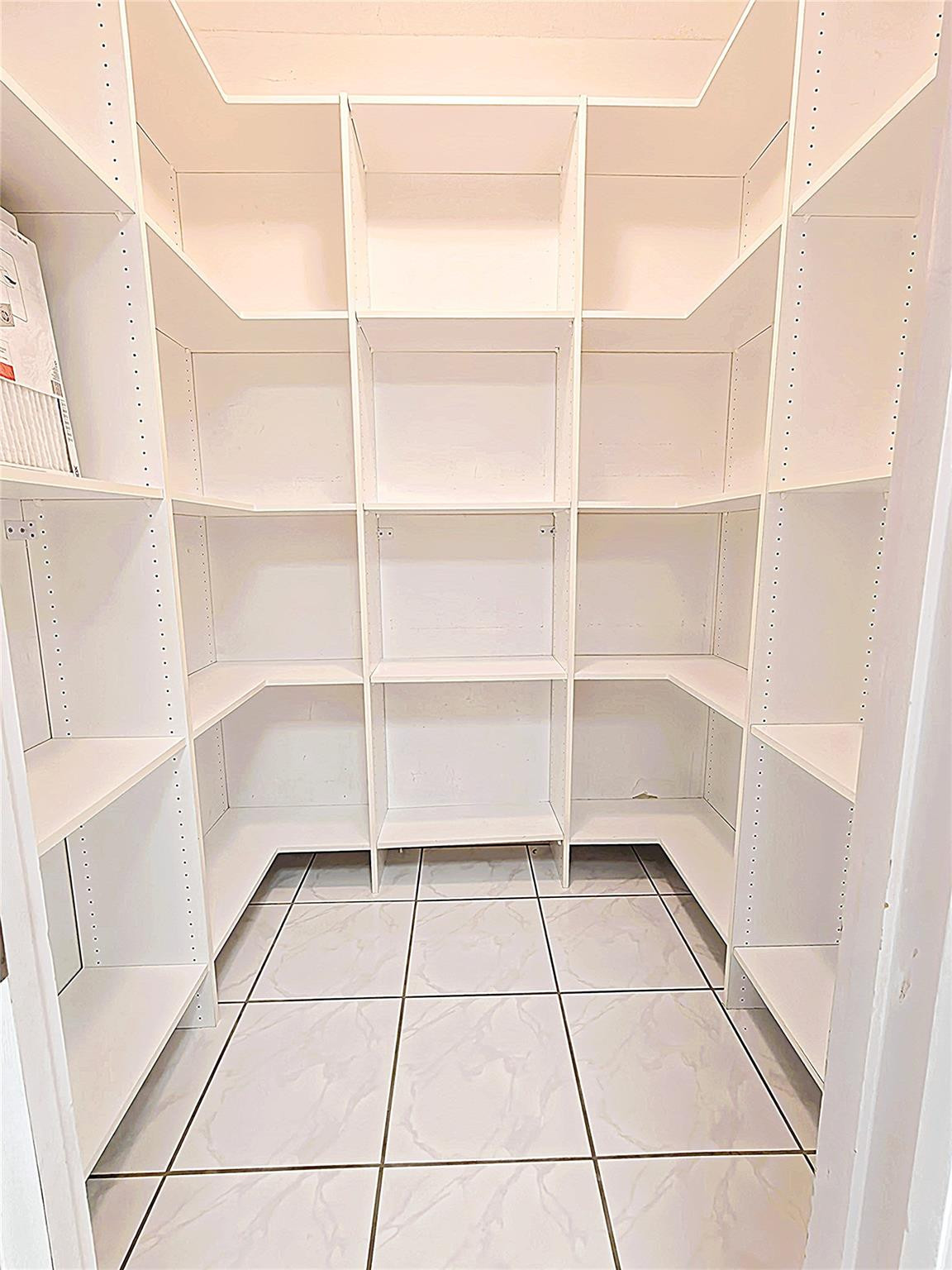 2939 Paddock Lane Weston, FL 33331 - Photo 64 of 86 a room with a black white checkered floor