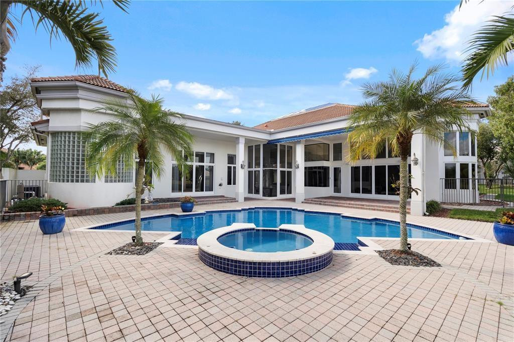 2939 Paddock Lane Weston, FL 33331 - Photo 67 of 86 a view of a house with swimming pool and sitting area