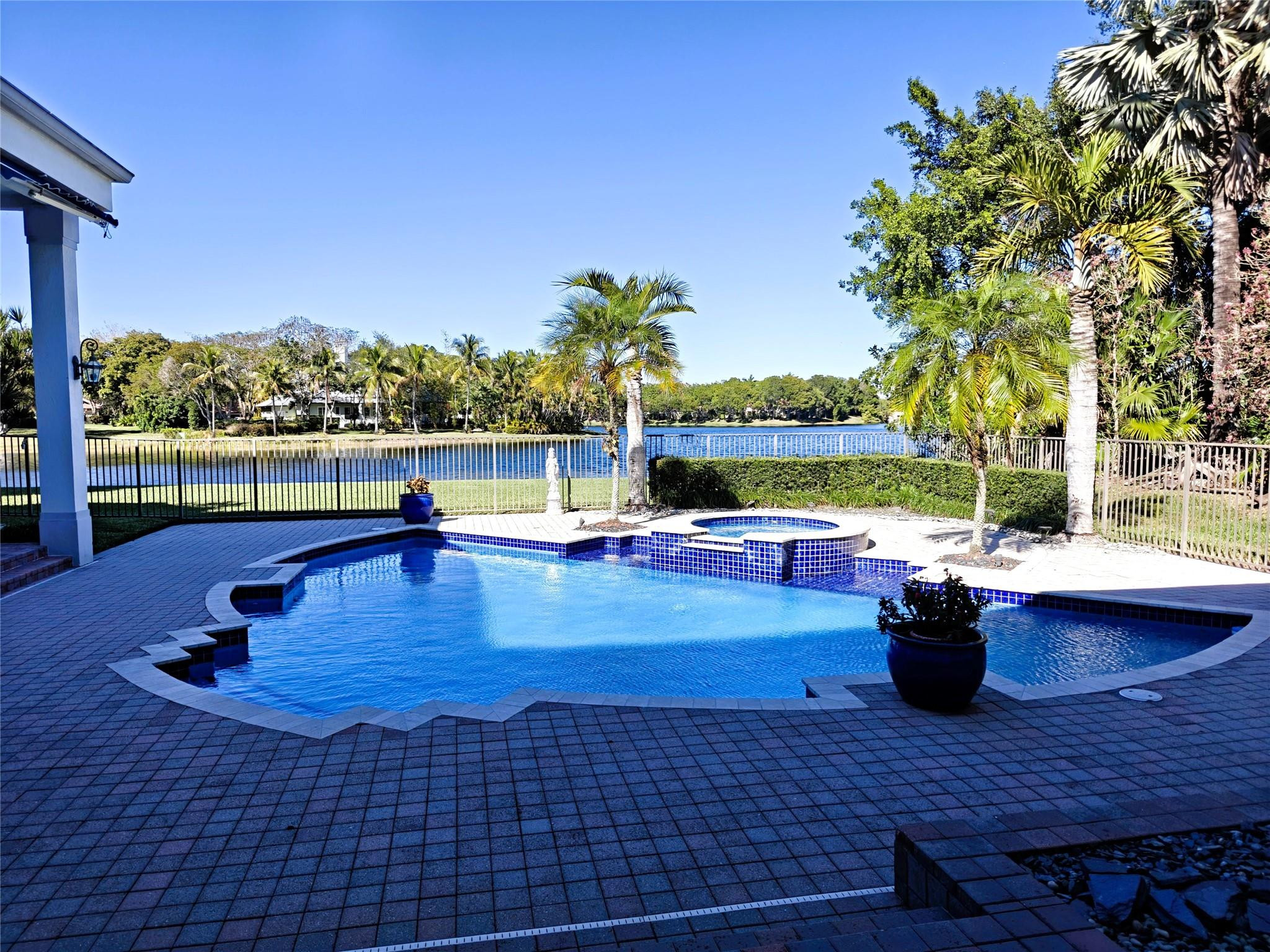 2939 Paddock Lane Weston, FL 33331 - Photo 70 of 86 a view of a swimming pool with lounge chair