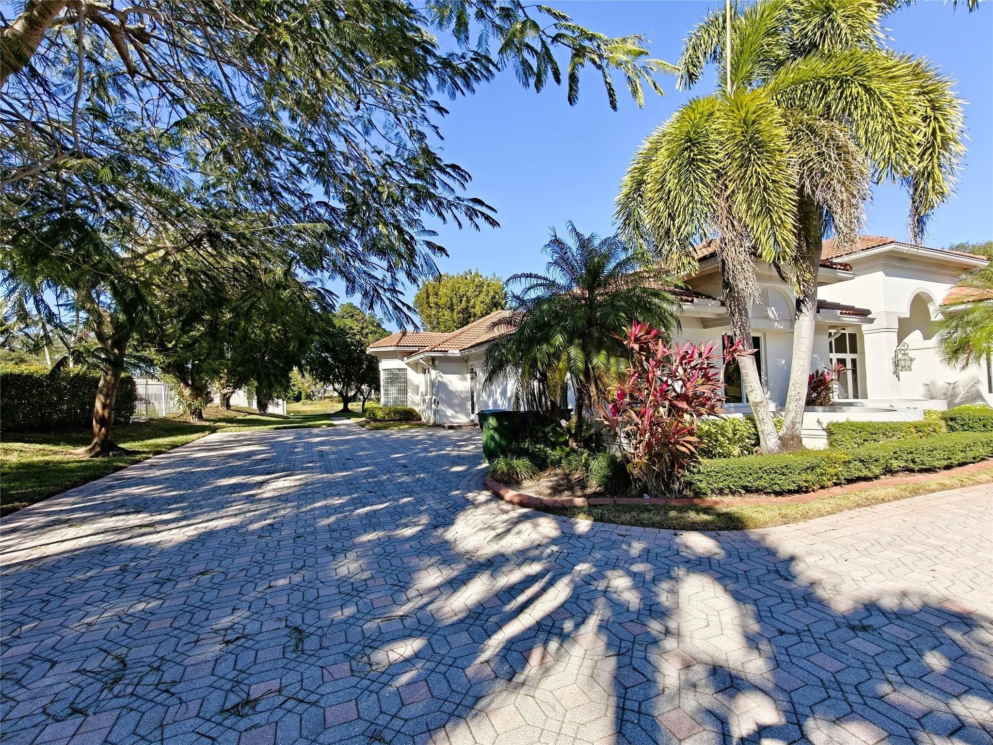 2939 Paddock Lane Weston, FL 33331 - Photo 76 of 86 a view of a yard with plants and trees