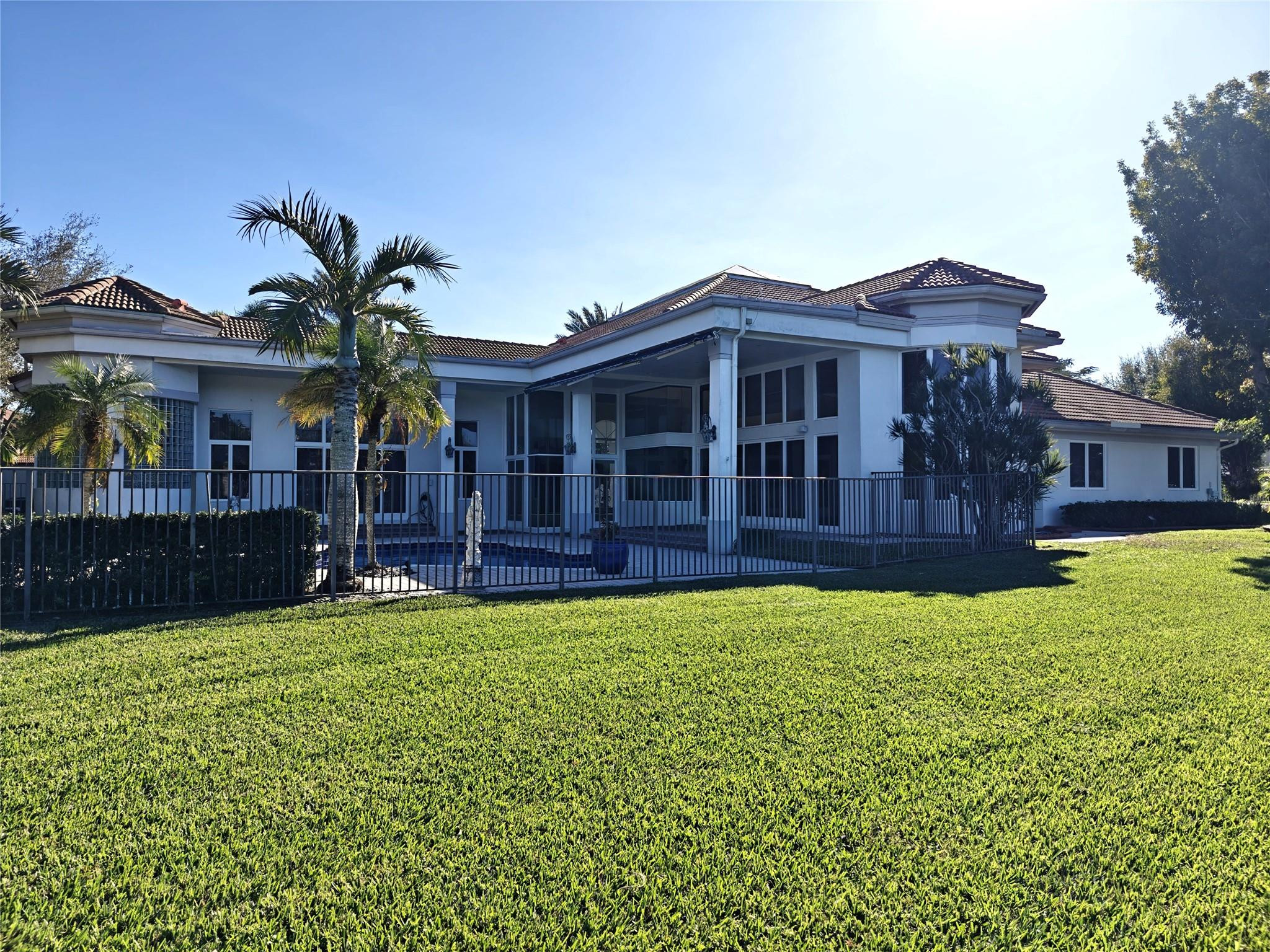 2939 Paddock Lane Weston, FL 33331 - Photo 81 of 86 a view of a house with a yard and a porch