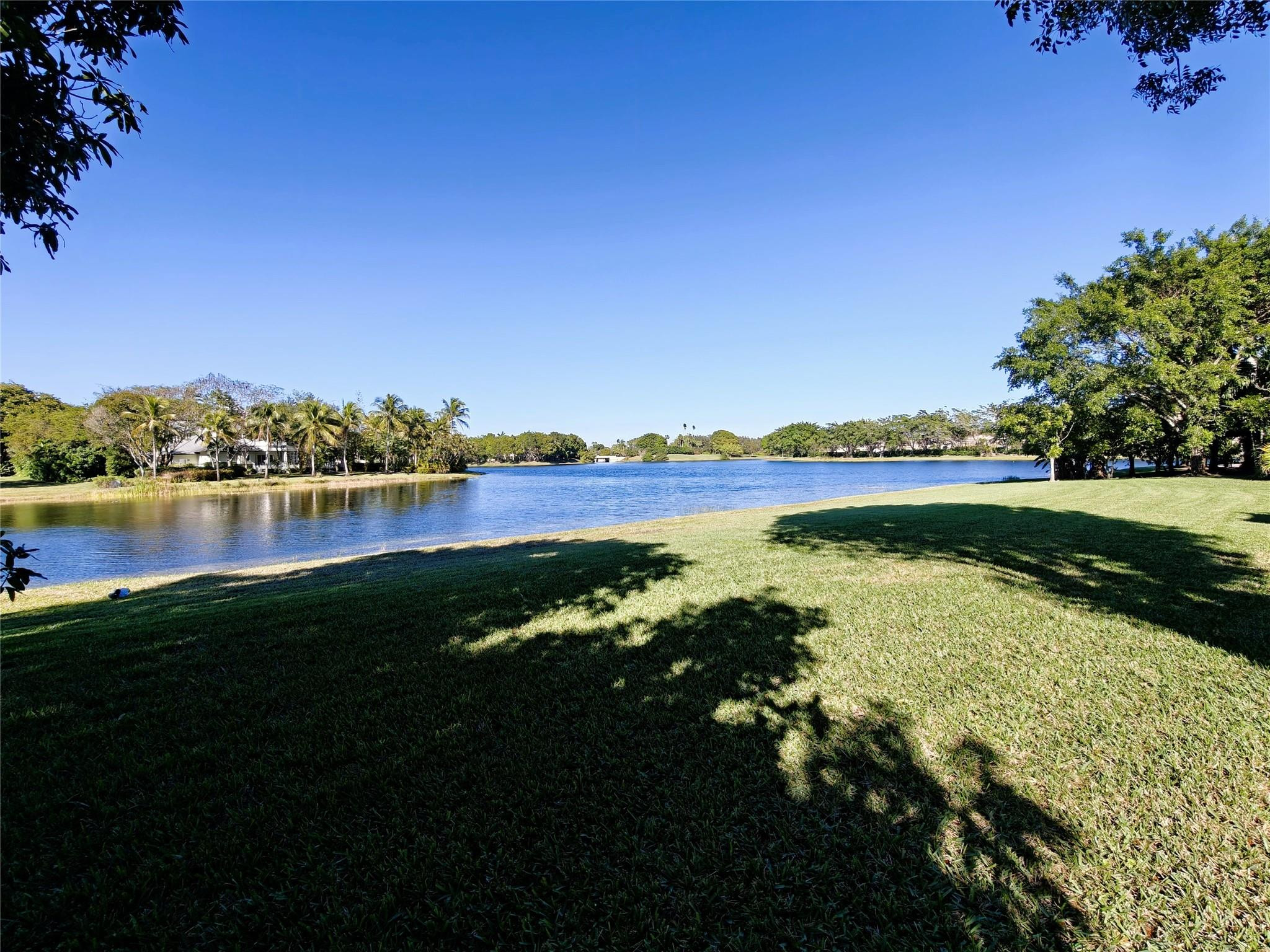 2939 Paddock Lane Weston, FL 33331 - Photo 83 of 86 a view of a lake with houses in the background