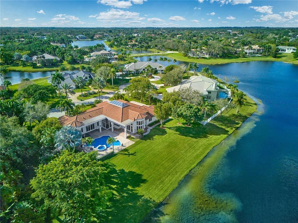 2939 Paddock Lane Weston, FL 33331 - Photo 84 of 86 an aerial view of a house with a garden and lake view