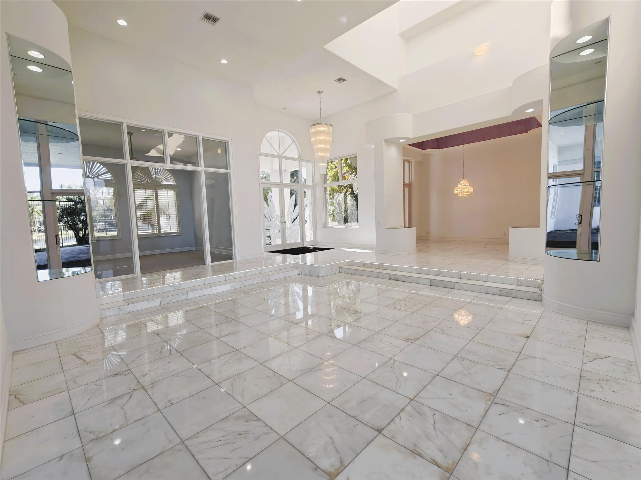 2939 Paddock Lane Weston, FL 33331 - Photo 9 of 86 a view of a hallway with a furniture and a large window
