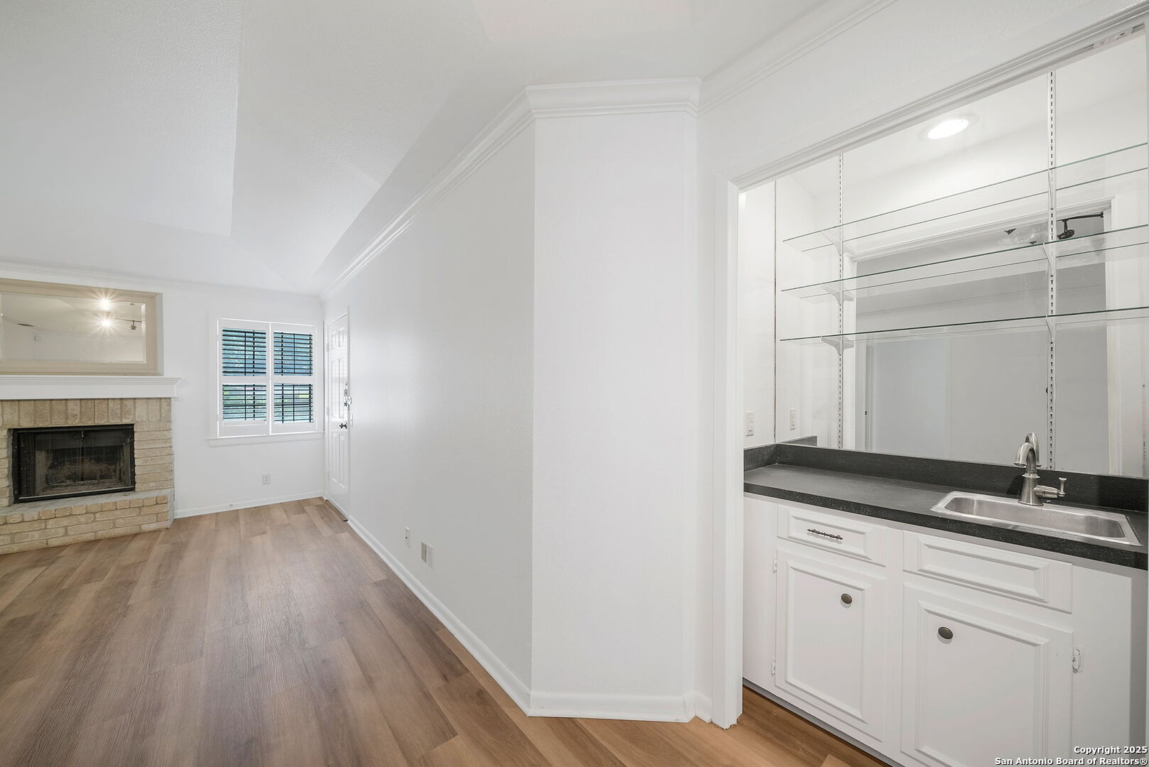 8415 Fredericksburg Road, Unit 704 San Antonio, TX 78229 - Photo 14 of 30 a view of a kitchen with granite countertop cabinets and wooden floor