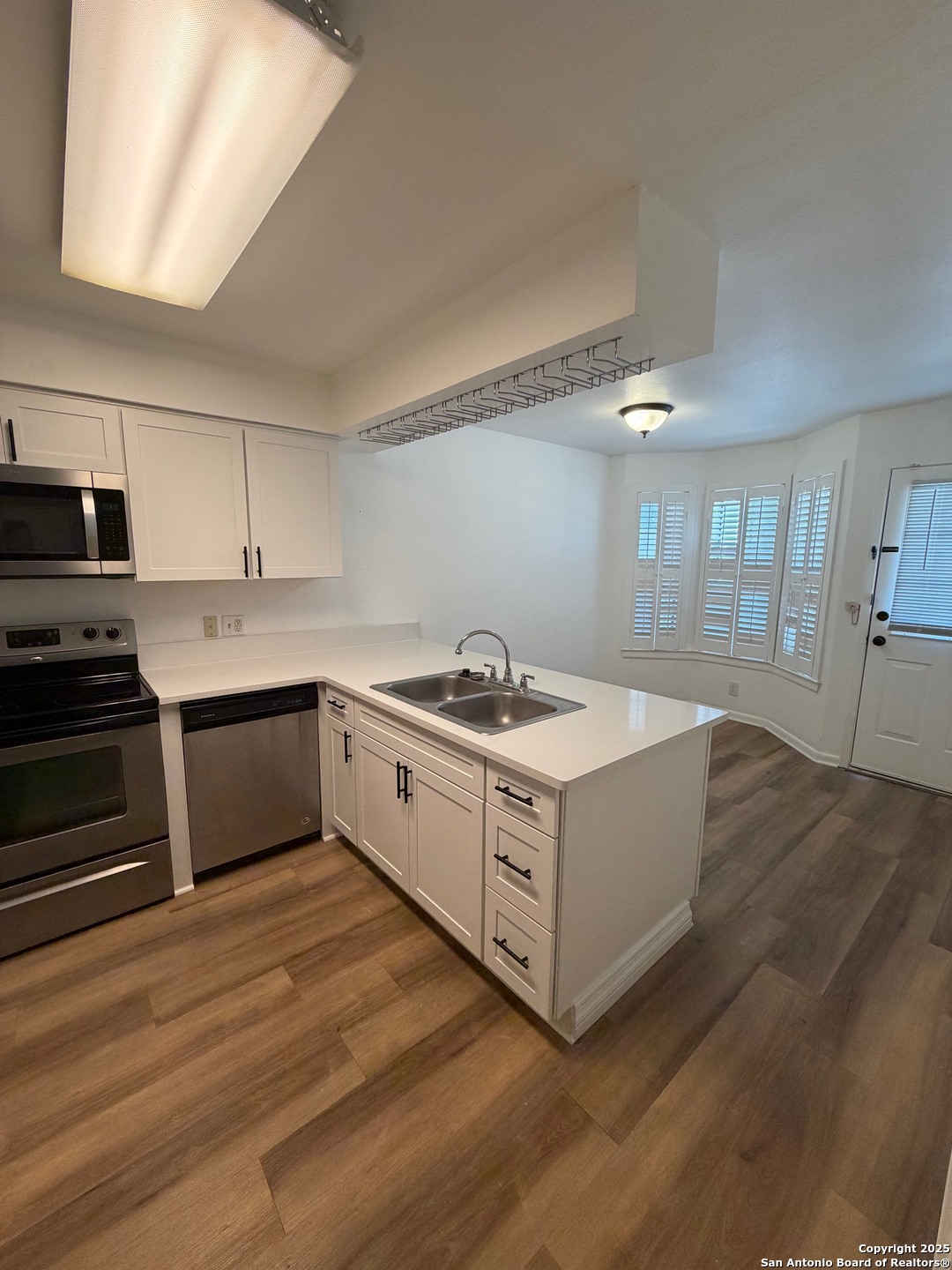 8415 Fredericksburg Road, Unit 704 San Antonio, TX 78229 - Photo 15 of 30 a kitchen with stainless steel appliances sink and cabinets