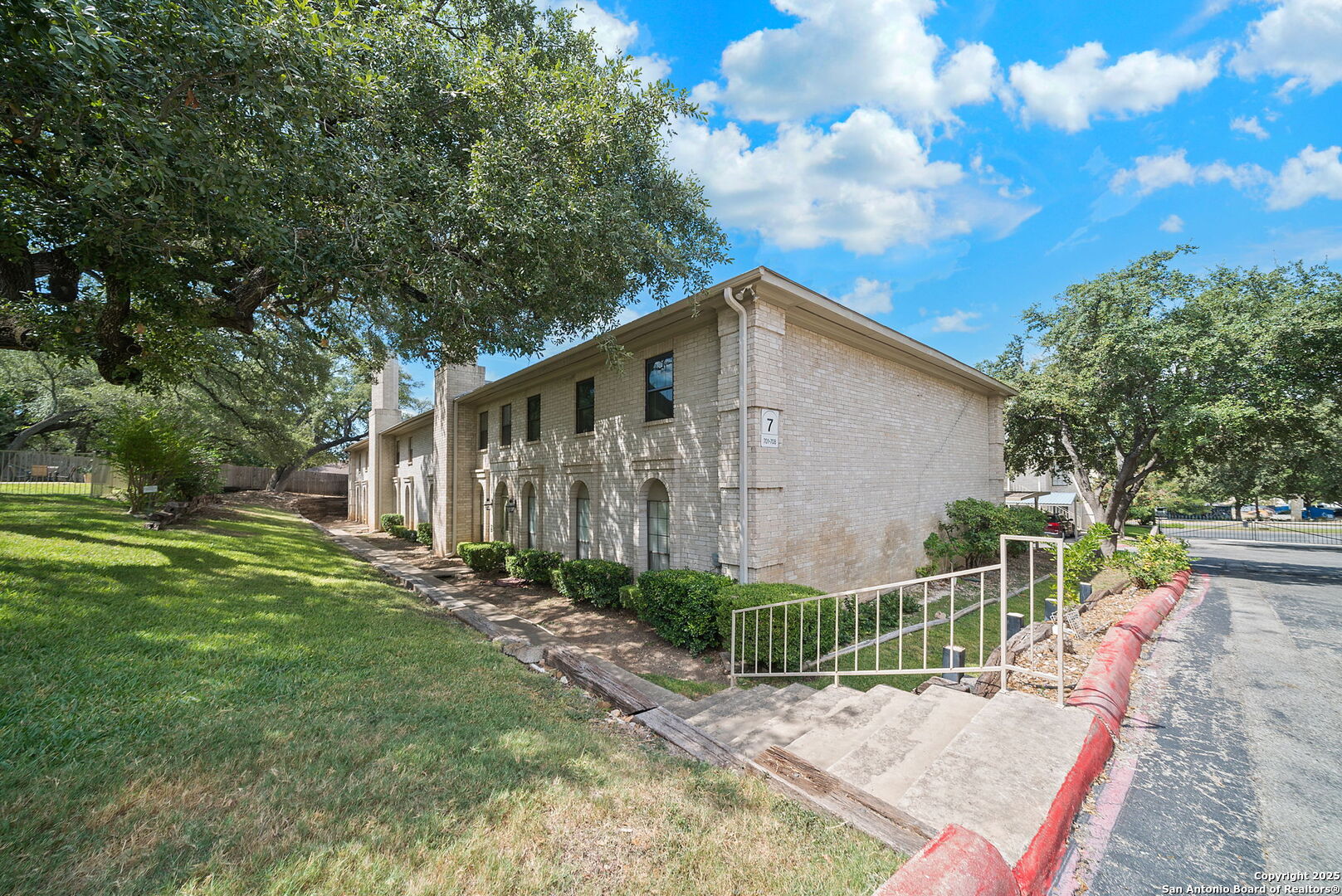 8415 Fredericksburg Road, Unit 704 San Antonio, TX 78229 - Photo 2 of 30 a view of a small house with wooden fence