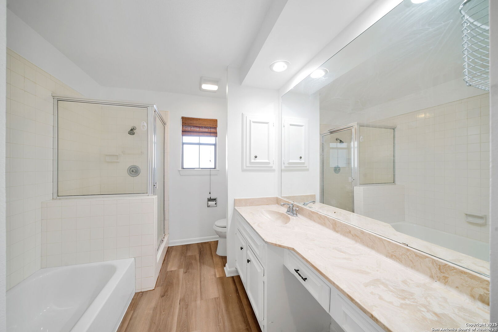 8415 Fredericksburg Road, Unit 704 San Antonio, TX 78229 - Photo 21 of 30 a spacious bathroom with a granite countertop tub sink shower and mirror