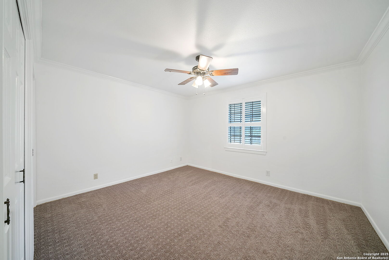 8415 Fredericksburg Road, Unit 704 San Antonio, TX 78229 - Photo 24 of 30 an empty room with windows and fan