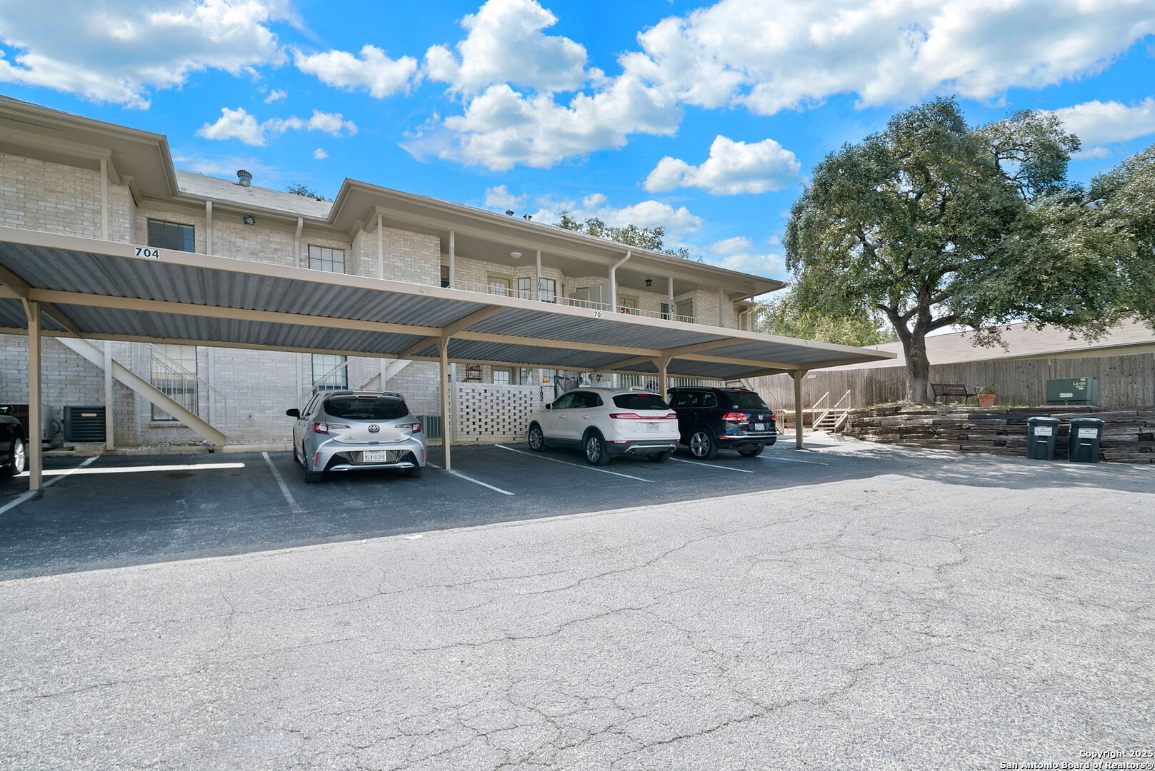 8415 Fredericksburg Road, Unit 704 San Antonio, TX 78229 - Photo 29 of 30 a car parked in parking area of a building