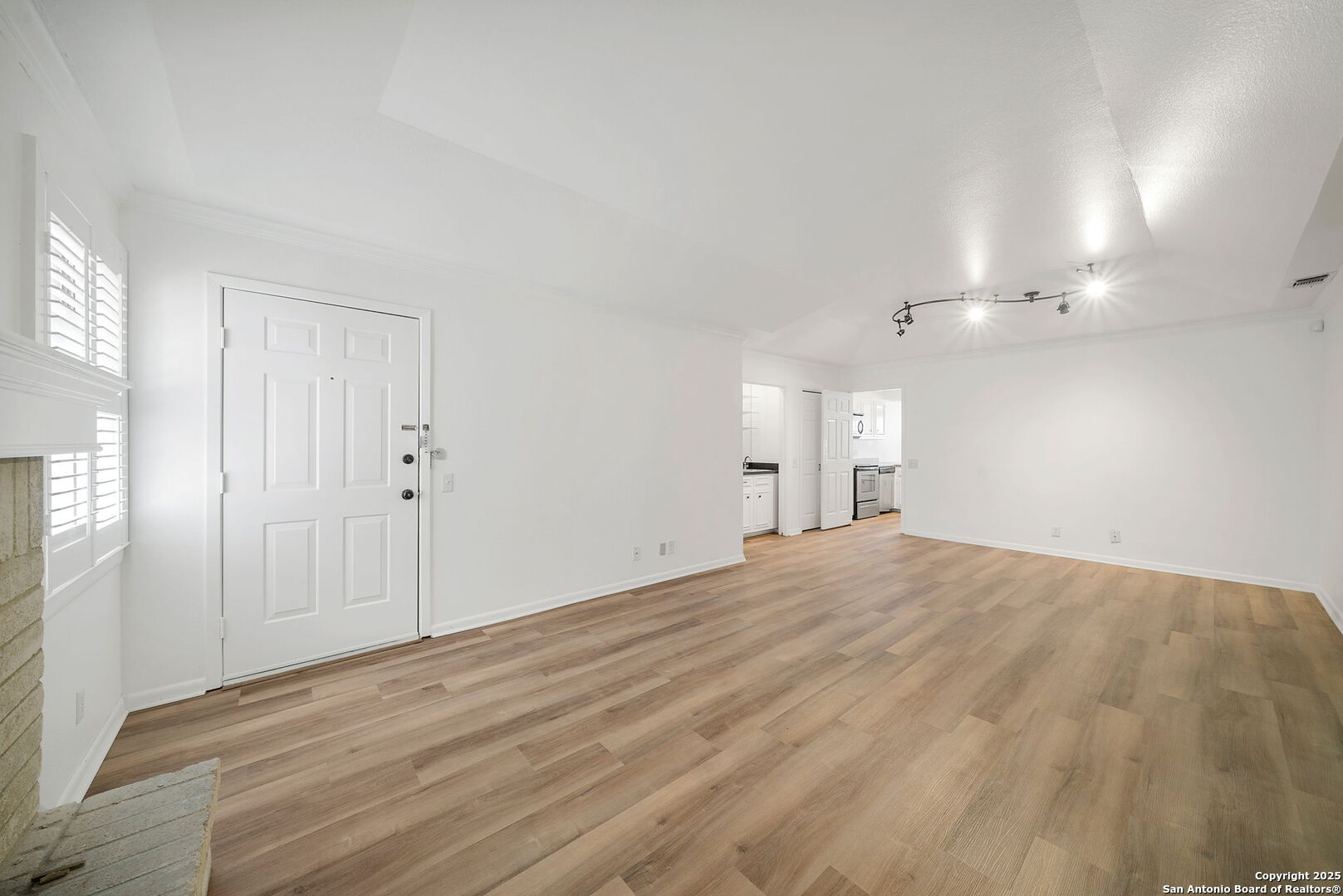 8415 Fredericksburg Road, Unit 704 San Antonio, TX 78229 - Photo 8 of 30 a view of empty room with wooden floor
