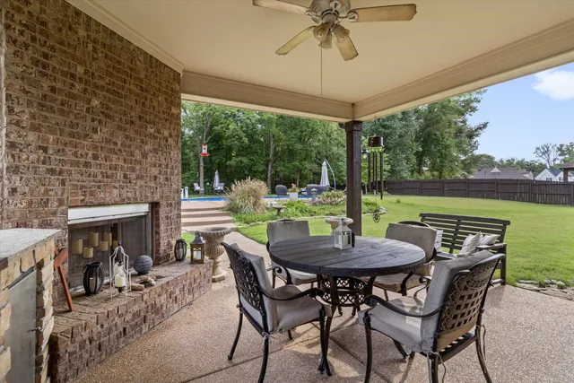a view of an outside dining space with furniture