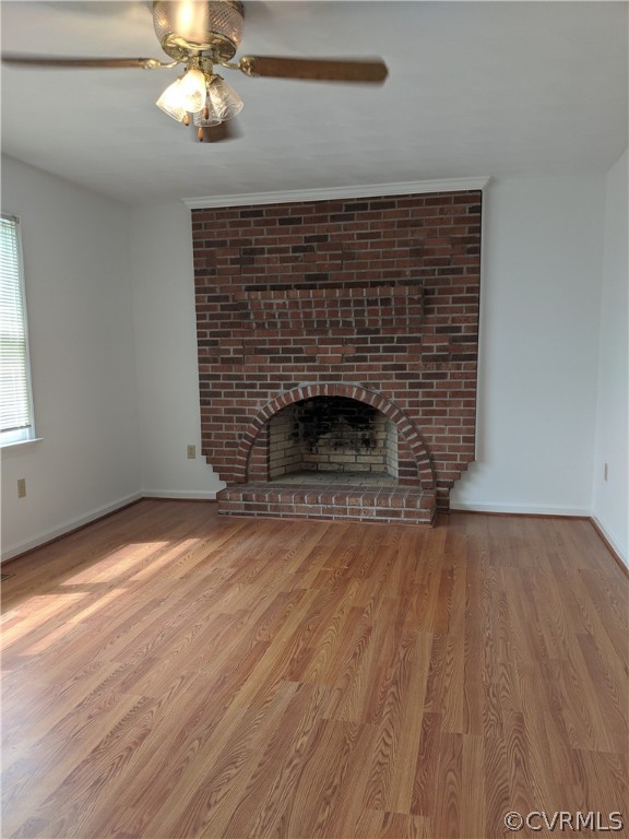 3424 Bacon School Road Saxe, VA 23967 - Photo 8 of 25 a view of empty room with wooden floor and fireplace
