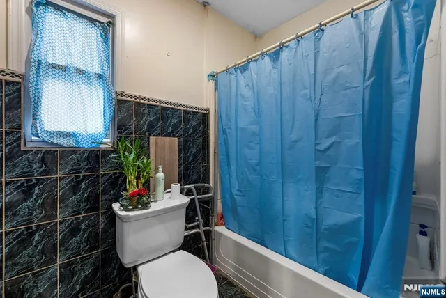 a view of a patio with fire pit and chairs