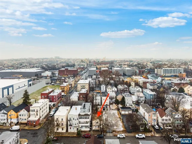an aerial view of a city with lots of residential buildings