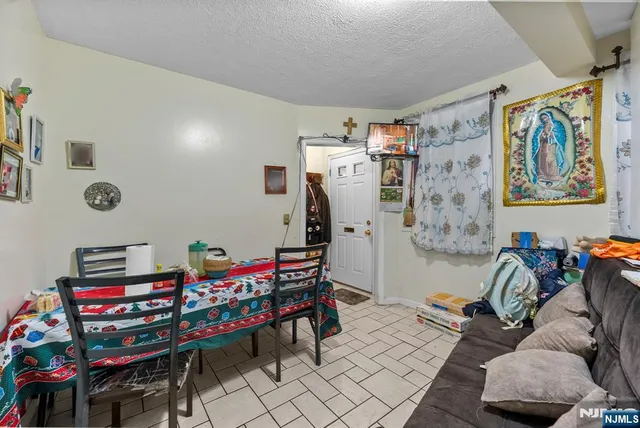 a kitchen with stainless steel appliances a refrigerator and a stove