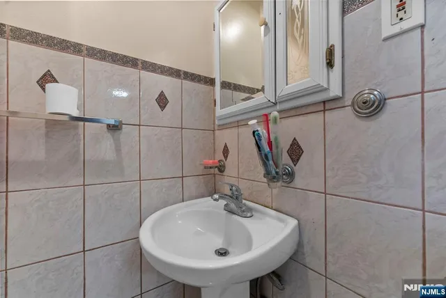 a bedroom with a bed and a wooden floor