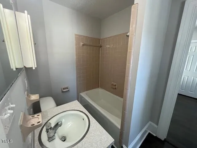 a bathroom with a toilet and a sink
