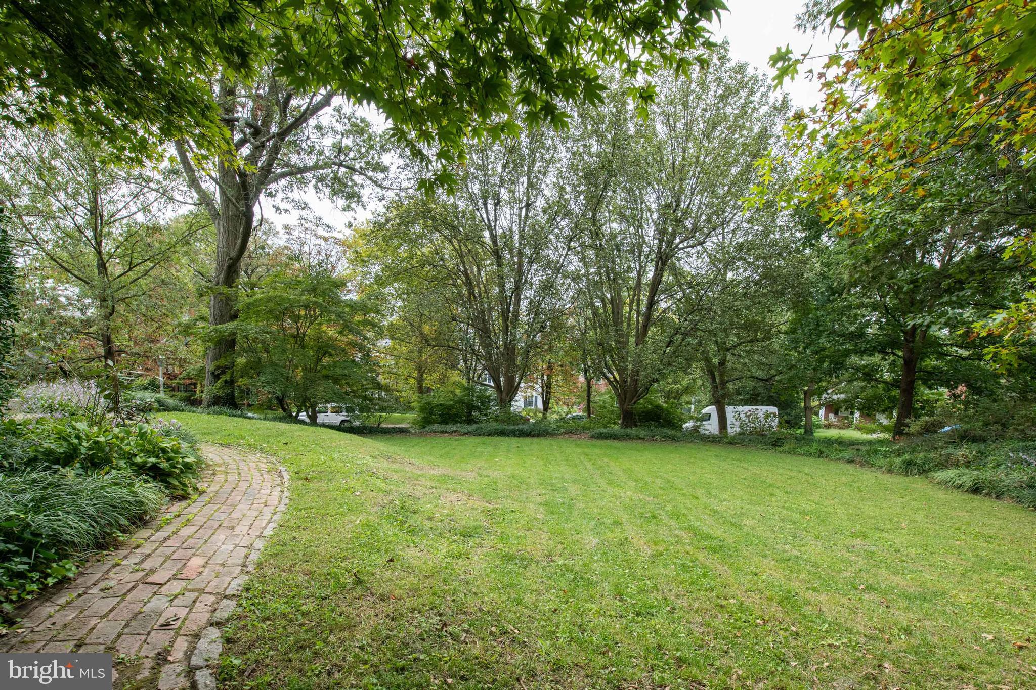 4123 Westview Road Baltimore, MD 21218 - Photo 30 of 39 FRONT/SIDE GARDEN WITH CHARMING BRICK PATHWAY