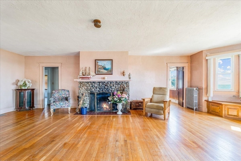 70 Hedge Road Plymouth, MA 02360 - Photo 12 of 41 a living room with furniture and a fireplace