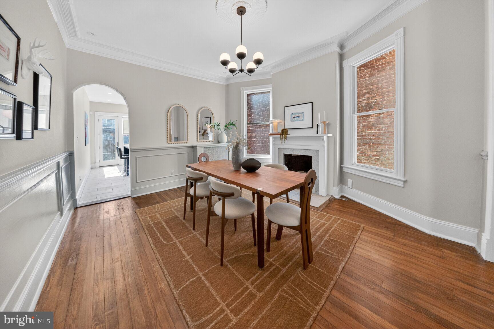 216 N Street Northwest Washington, DC 20001 - Photo 10 of 30 a dining room with furniture a chandelier and wooden floor