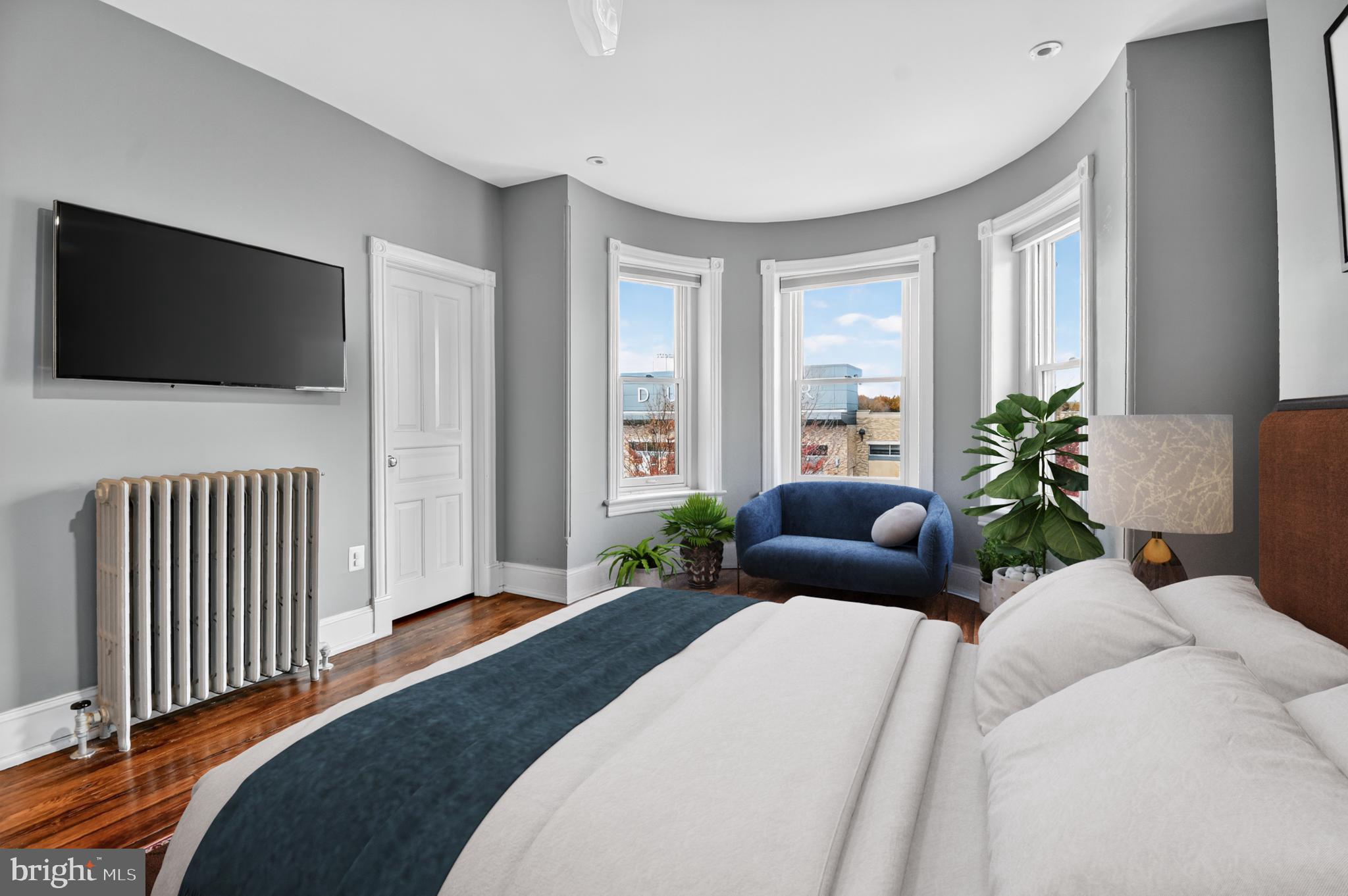 216 N Street Northwest Washington, DC 20001 - Photo 15 of 30 a bedroom with a large bed and a flat screen tv