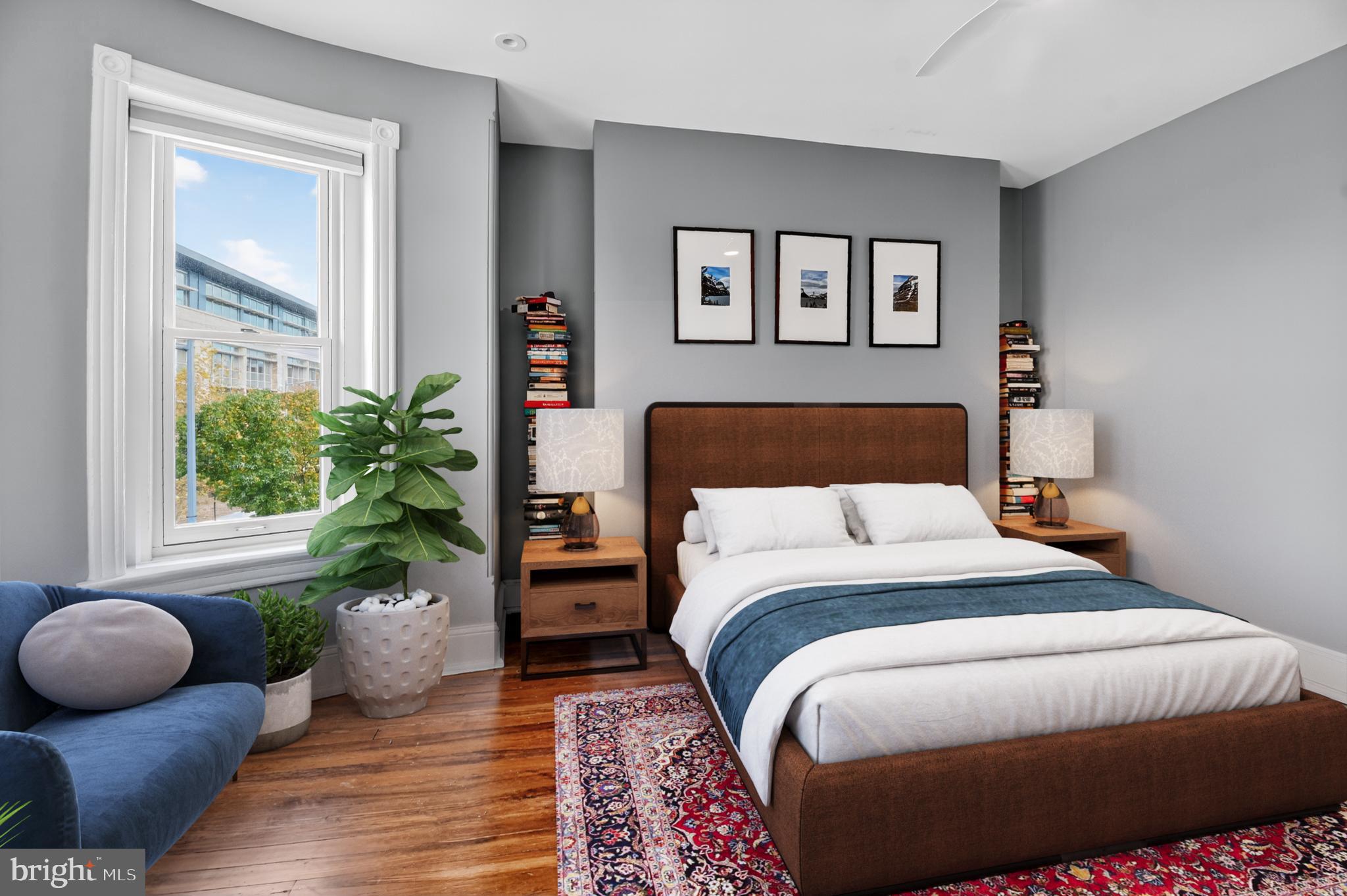 216 N Street Northwest Washington, DC 20001 - Photo 16 of 30 a bedroom with a bed and a potted plant