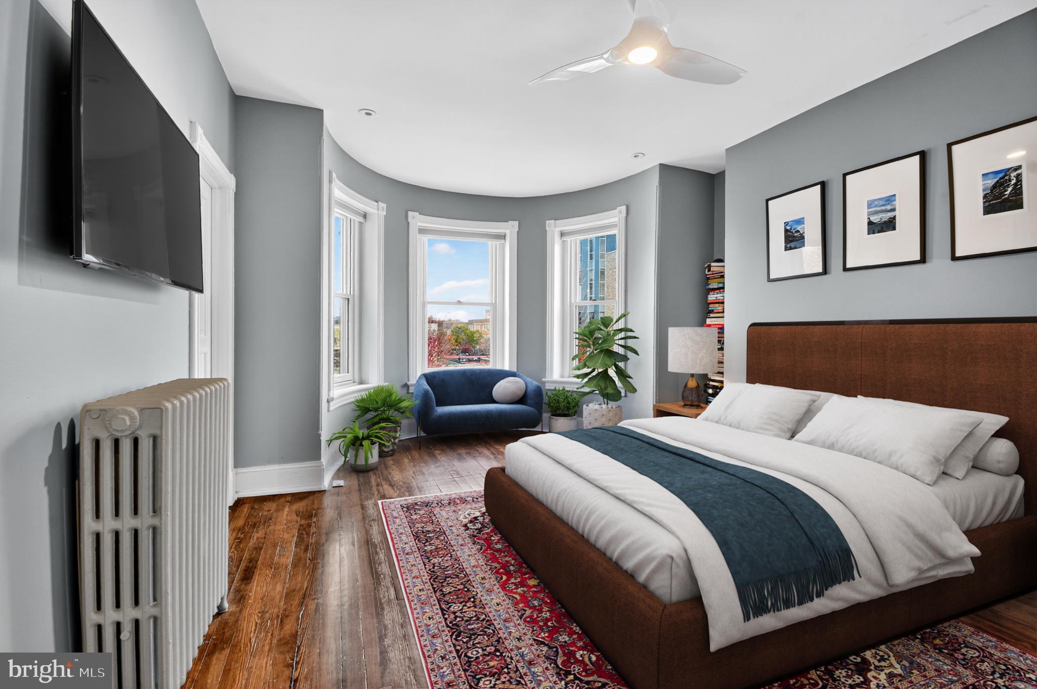 216 N Street Northwest Washington, DC 20001 - Photo 18 of 30 a bedroom with a bed and wooden floor