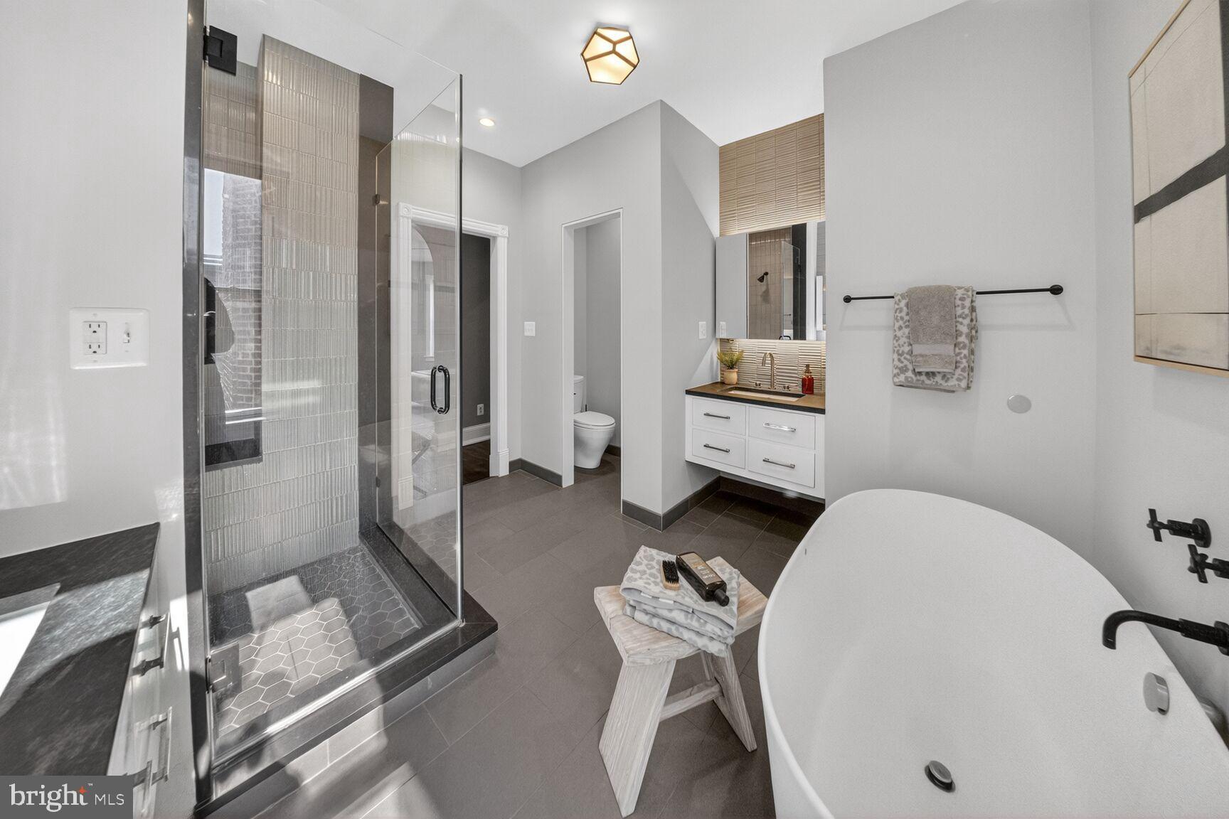 216 N Street Northwest Washington, DC 20001 - Photo 19 of 30 a bathroom with a tub sink and mirror