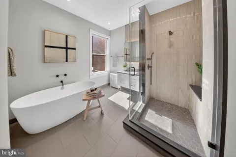 a en suite bathroom with a toilet sink and shower