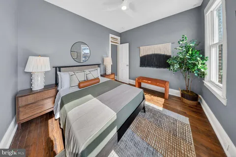 a bed room with a bed and a chandelier