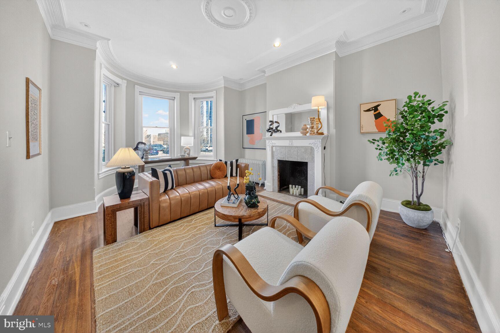 216 N Street Northwest Washington, DC 20001 - Photo 4 of 30 a living room with furniture fireplace and potted plant
