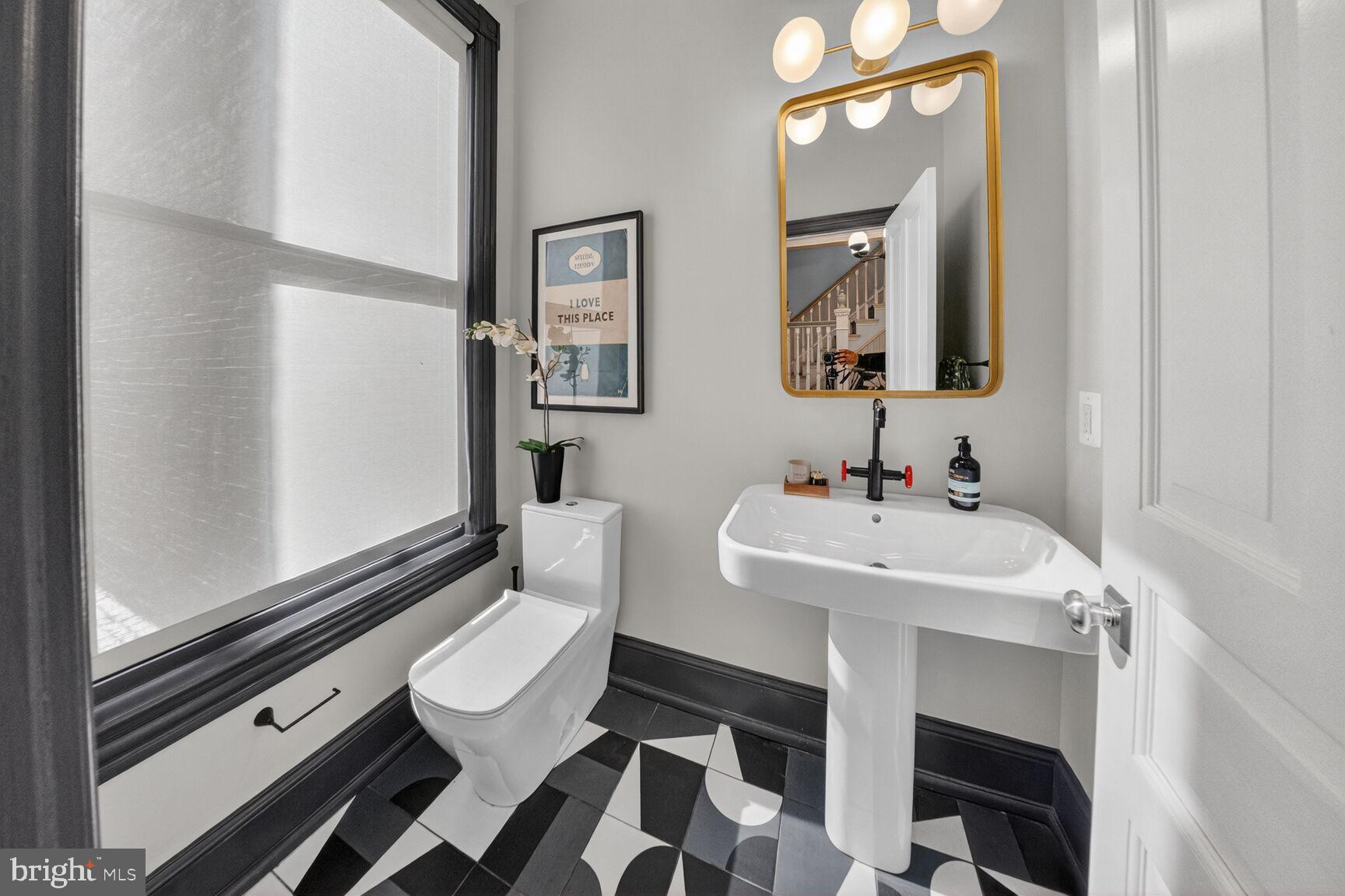 216 N Street Northwest Washington, DC 20001 - Photo 7 of 30 a bathroom with a sink toilet and mirror