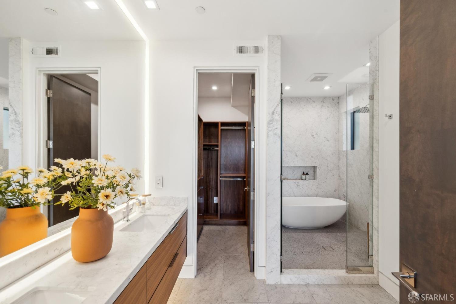 714 Rhode Island Street San Francisco, CA 94107 - Photo 15 of 32 a spacious bathroom with a granite countertop sink and a mirror