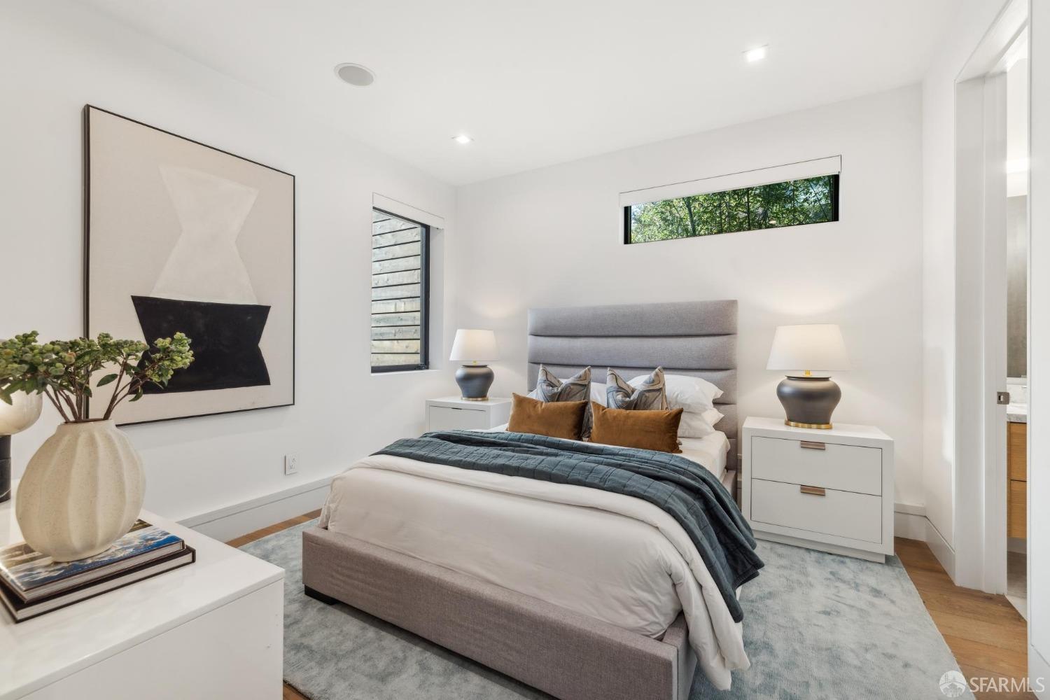 714 Rhode Island Street San Francisco, CA 94107 - Photo 19 of 32 a bedroom with a bed and a flat screen tv