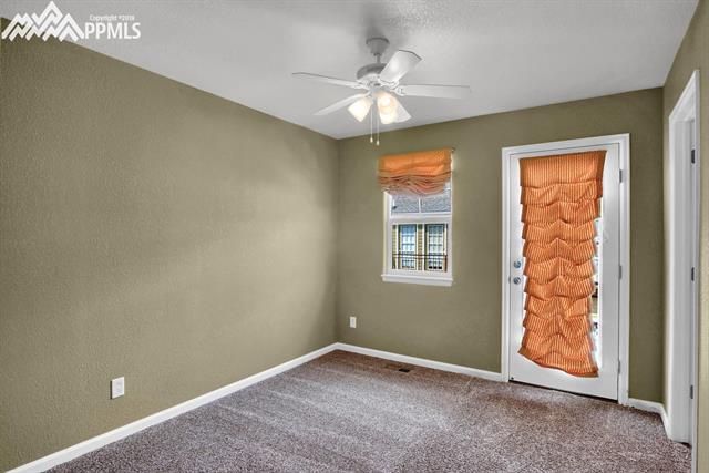 811 Weber Ridge Point Colorado Springs, CO 80903 - Photo 17 of 32 Bedroom upstairs with small balcony