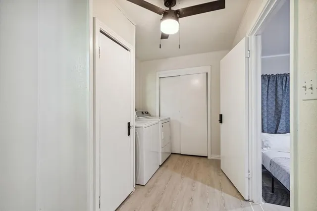 a view of hallway with chandelier
