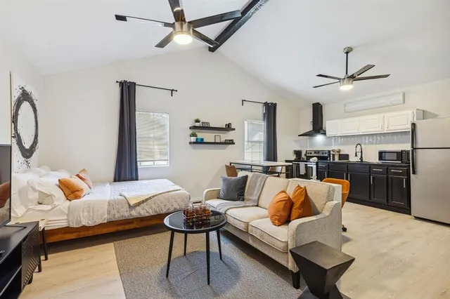 a bedroom with furniture and a chandelier