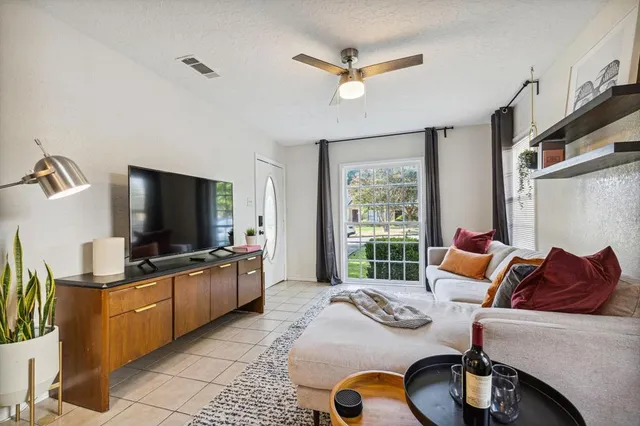 a living room with furniture and a flat screen tv
