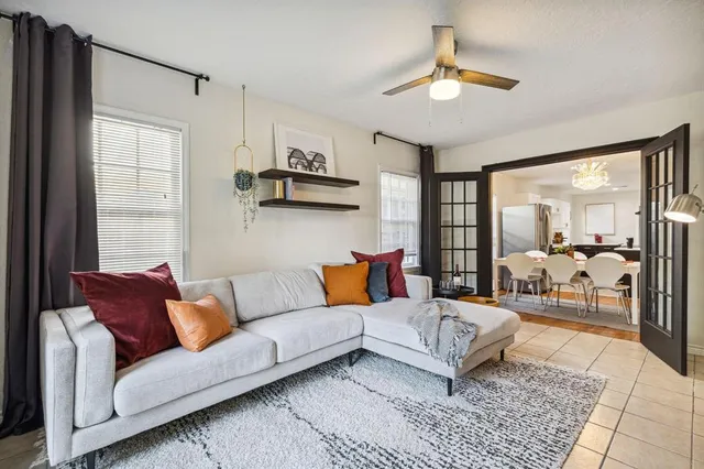 a living room with furniture and a rug