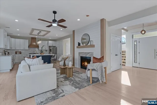 a living room with furniture and a fireplace