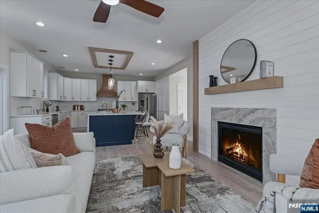 a living room with furniture and a fireplace